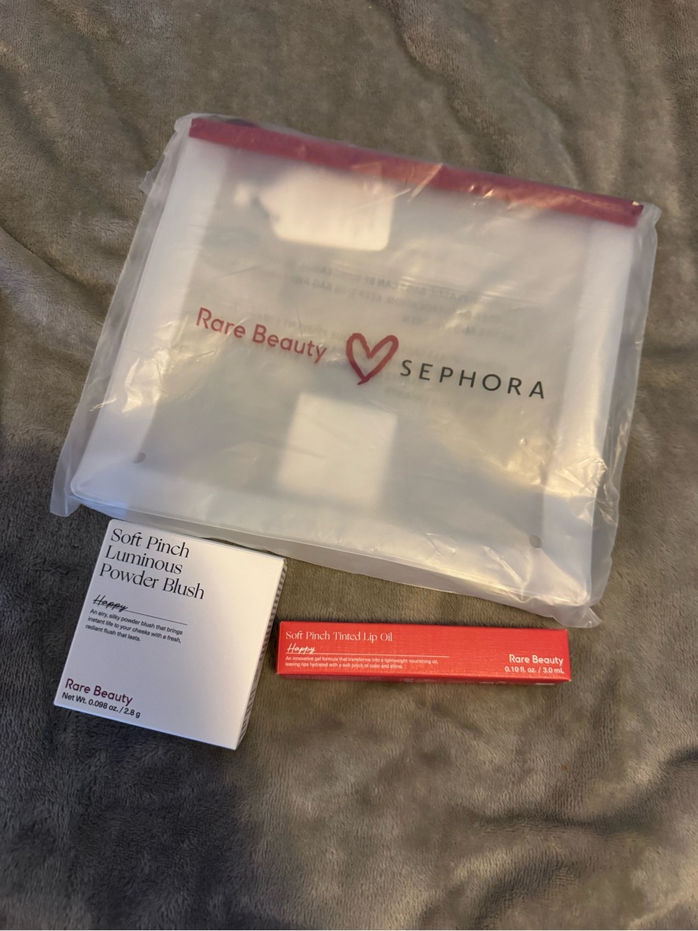 Rare beauty blush and lip oil stain in happy with pouch